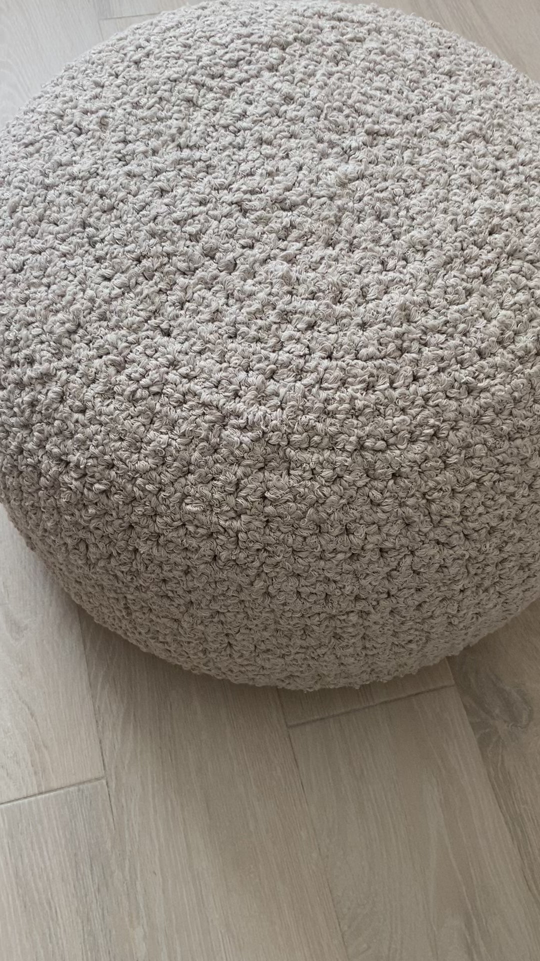 video of boucle ottoman pouf knitted by looping home