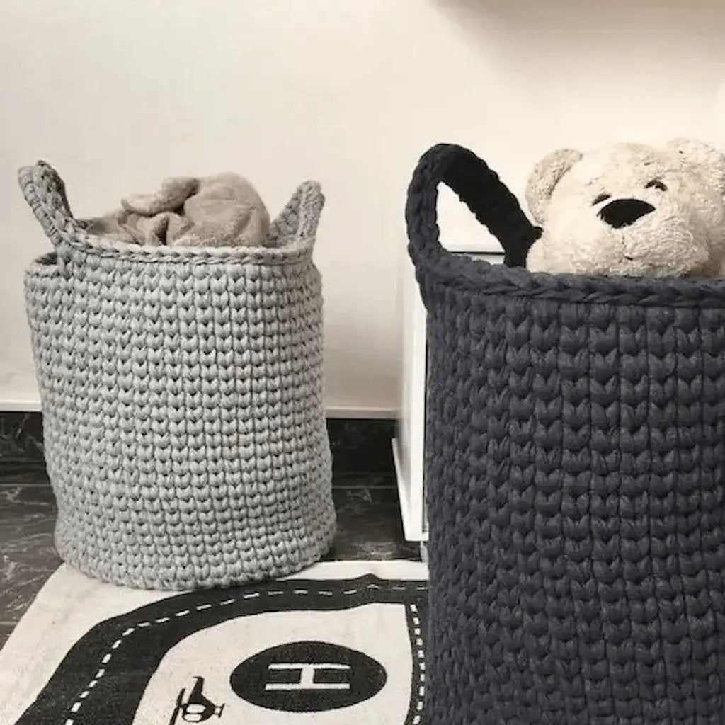 crochet storage baskets in gray and navy blue with toys for kids room 