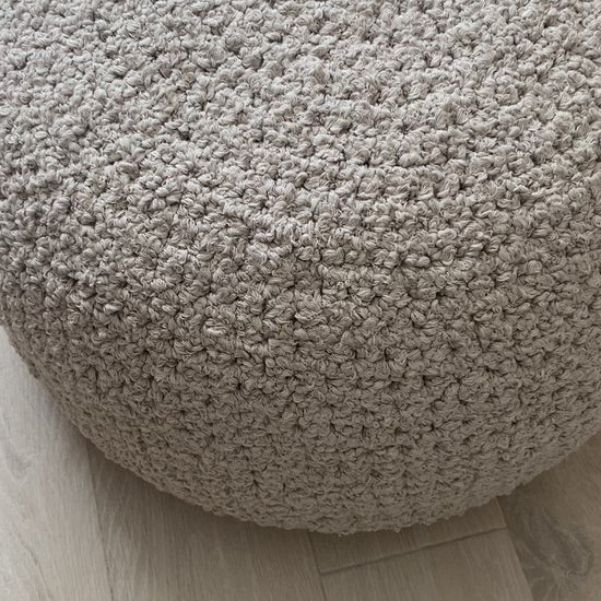 ivory bouclépouf-round footstool