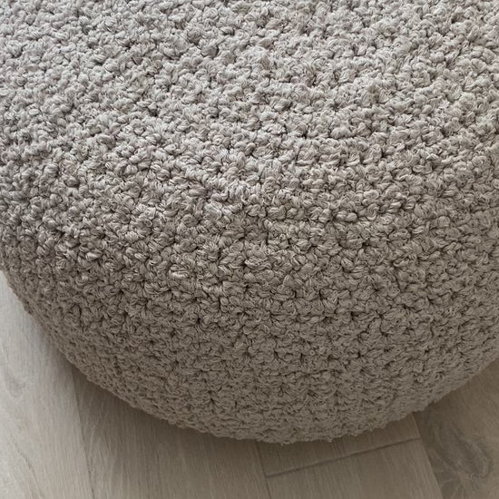 video of boucle ottoman pouf knitted by looping home