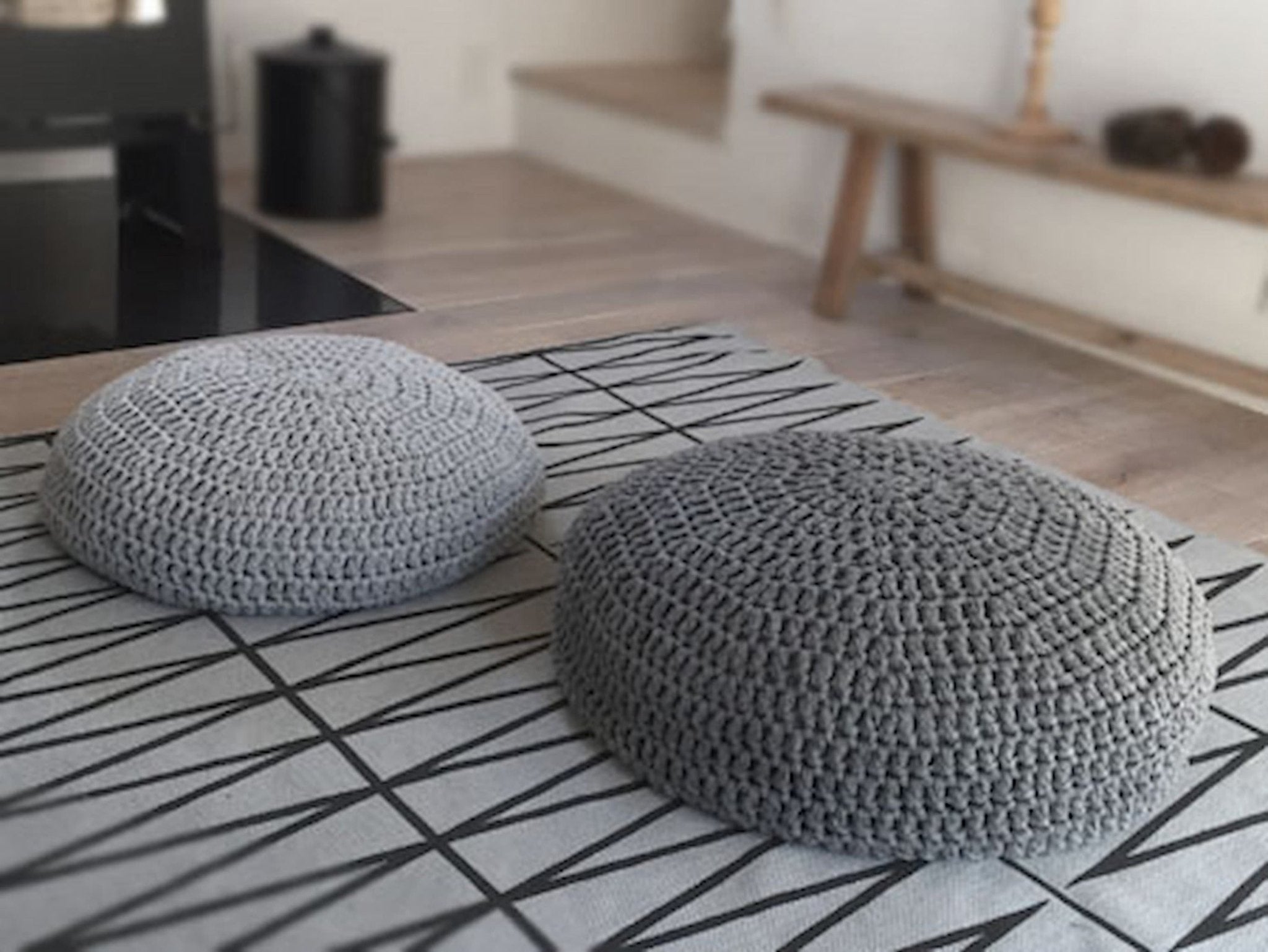 Large grey floor outlet cushion